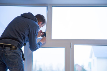 Installation of window film in the office. Protection from ultraviolet radiation.