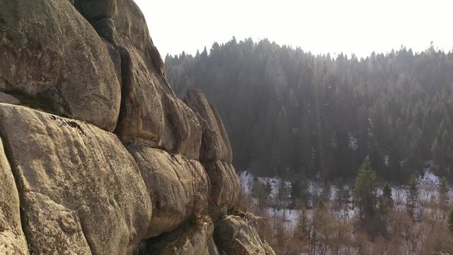 Rocks and winter forest at Ukraine.