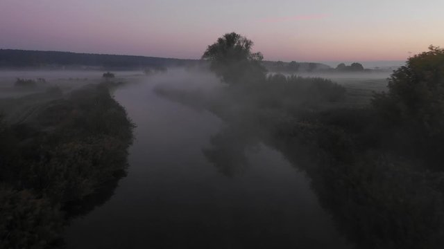 Trip down the river at beautiful early fooggy morning. 4k