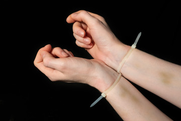 White plastic handcuffs hurt hands.