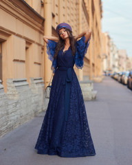 Fototapeta premium Woman in blue evening dress