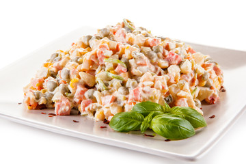 Vegetable mayonaise salad on white background