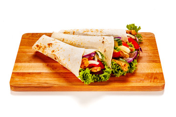 Tortilla wraps on cutting board on white background