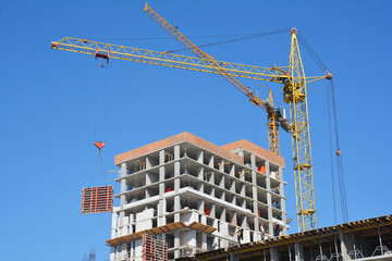 Cranes construction. Building construction growth and global construction industry and gdp growth concept