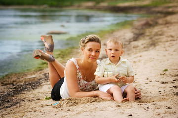 Mother and son enjoying time at beach
