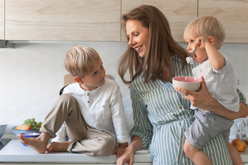 Family having breakfast at kitchen.