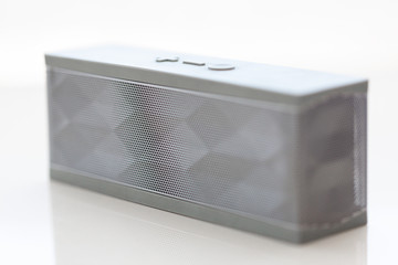 Modern grey bluetooth speaker white background