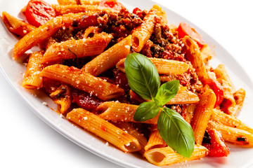 Penne with meat, tomato sauce and vegetables