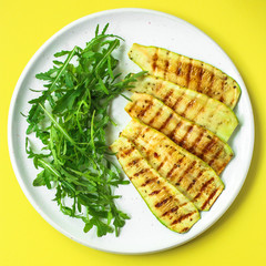 grilled zucchini (fried vegetables and salad, main course, healthy food) menu concept. food background. copy space. Top view