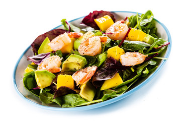 Salad with shrimps on white background