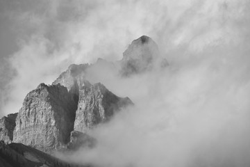  Clouds partially obscuring peak of cascade mountain in Banff national park.