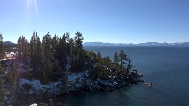 Flight over Emerald Bay at Lake Tahoe at sunny winter day. 4k