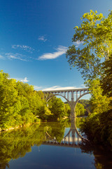 Arch bridge spanning a river in Cuyahoga Valley National Park