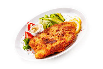 Fried pork chop and vegetable salad on white background