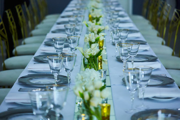 Elegance table set up with lotus flowers, selective focus.