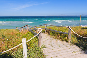 Scenic stairway leading down to the beautiful Muro beach (Playa de Muro) in Mallorca. Spain
