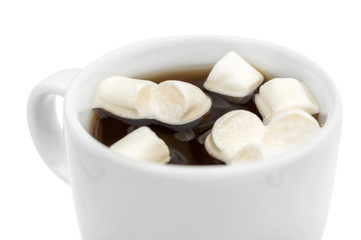 Hot coffee with marshmallow. Close up. Isolated on white.