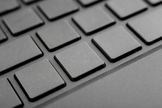 keyboard keys of a personal computer or laptop close - up without inscriptions with free space for your text, blank, design, copy space, mock up