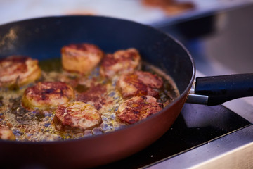 The beef steak in a frying pan