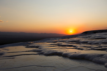 Fototapeta premium sunset view over white frozen hills