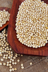 Soya beans closeup on wooden platter