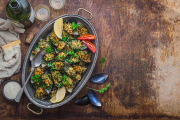 Baked mussels with cheese parmesan and bread crumbs, copy space