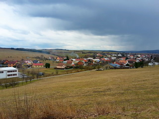 Typical village in the Czech Republic in spring, with partly cloudy skies