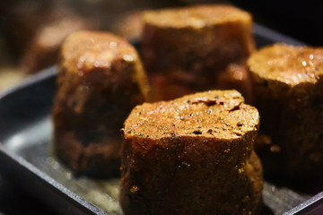 The beef steak in a frying pan. Shallow dof