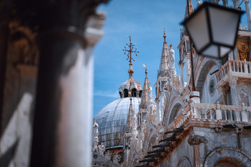 Close up of St Mark's Cupel on the top of Basilica di San Marco, St Mark's Basilica in Venice, Italy. Detailed facade against blue sky. Italy, Europe