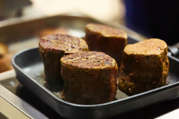 The beef steak in a frying pan. Shallow dof