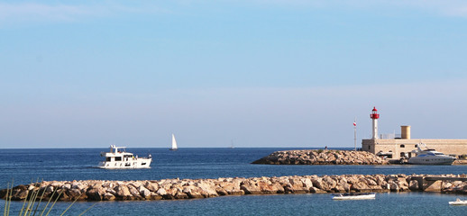 French Riviera - boat entering the port of Menton