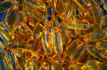 Close up of Omega 3 oil capsules. Health care concept. 