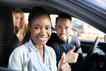 Afro African Woman Sitting In Car With Her Friends