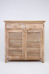 Wooden light brown vintage cabinet with two drawers and two doors. Made of natural materials. Vintage retro style furniture isolated on white background_1