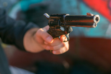 criminal holding a gun replica at gunfight