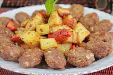 baked meatball potato dish on a plate