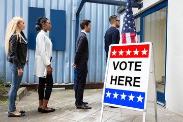 People Standing Outside Voting Room