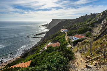Scenic footpath on the cliffs of the Praia de Arrifana one of the beautiful beach of Costa Vicentina, Aljezur, Algarve, Portugal