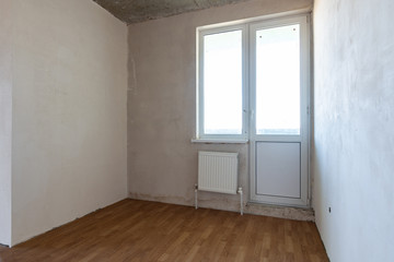 Corner of the room with access to the balcony