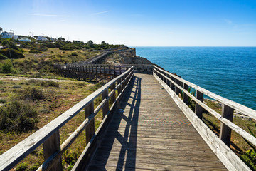 Obraz premium Carvoeiro boardwalk is a scenic cliff top walk that leads from the town to the Algar Seco rock formation, Algarve, Portugal