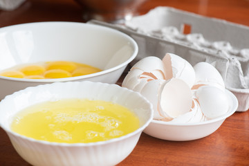 Egss separated into whites and yolks with shells