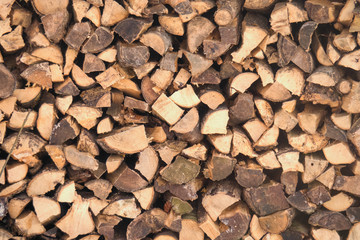 Stack of wood arranged to a wall