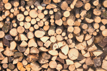 Stack of wood arranged to a wall