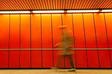 Orange abstract of woman in tunnel