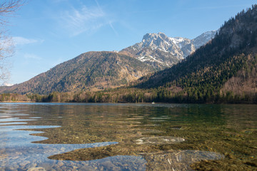 Naklejka na ściany i meble Scenic view of the great landscape reflecting on the shallow crystal clear water of the Vorderer Langbathsee near Ebensee, Oberösterreich, Austria