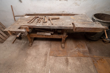 Traditional old workbench of a carpenter in his workshop in the Alpine region in Austria