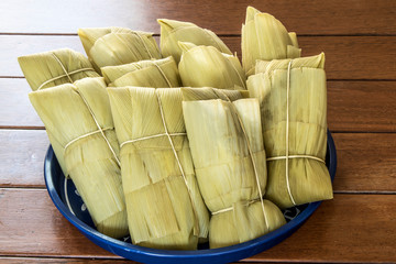 Pamonha. Brazilian Corn Snack on wooden background in Brazil