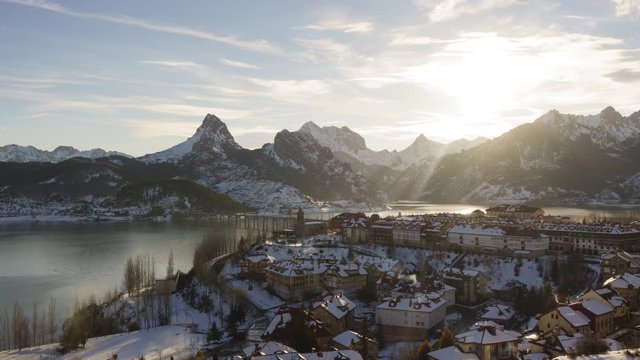 Day to Night Time Lapse of mountain village covered in snow