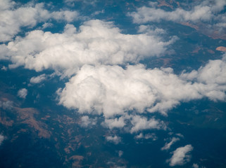 Fototapeta na wymiar cloudscape land aerial view from airplane