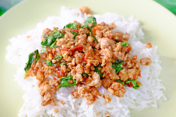 Rice topped with Minced pork and basil leaf. Traditional Thai street food.